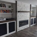 Warwick Interiors stone fireplace and flooring in a modern living room